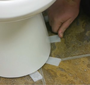 Put-shims-and-silicone-under-the-toilet